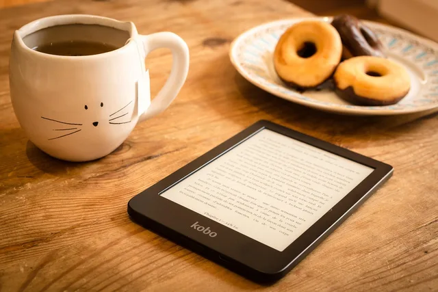 reading, refreshments, e-reader, doughnuts, donuts, dessert, tea, book, e-book, snack, reading, reading, tea, tea, book, book, book, book, book. Five newsletter monetisation business models compared