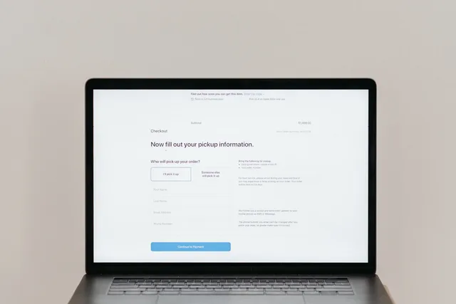 A laptop displaying an online checkout form, highlighting technology and e-commerce. Newsletter monetisation UK regulations: when tests apply
